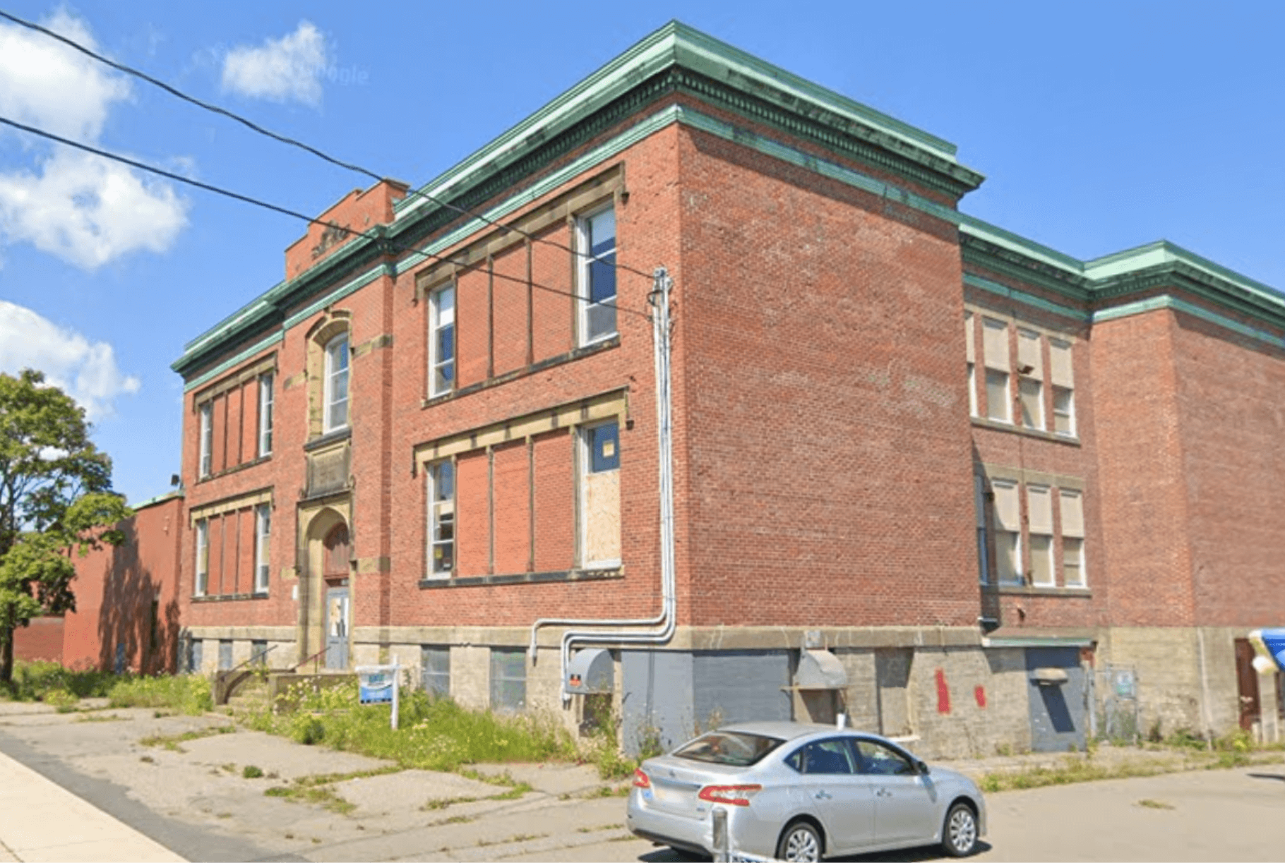 A two storey apartment building with red bricks.